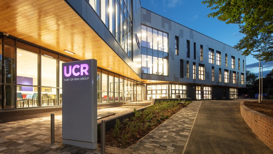 Exterior of University College Rotherham lit up in the evening