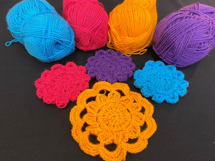 Crochet flowers and balls of yarn