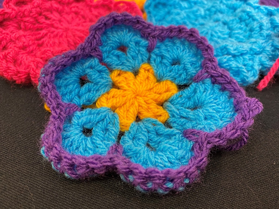 A crochet flower in different colours
