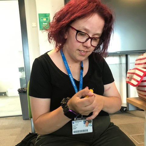 Woman knitting flowers