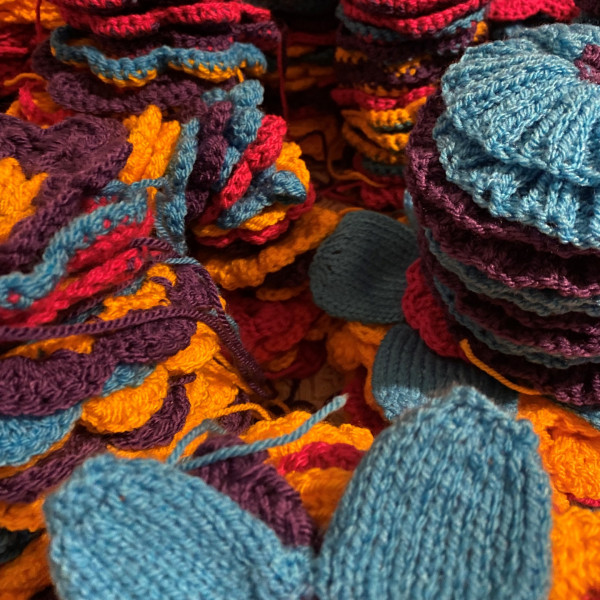 Piles of knitted flowers
