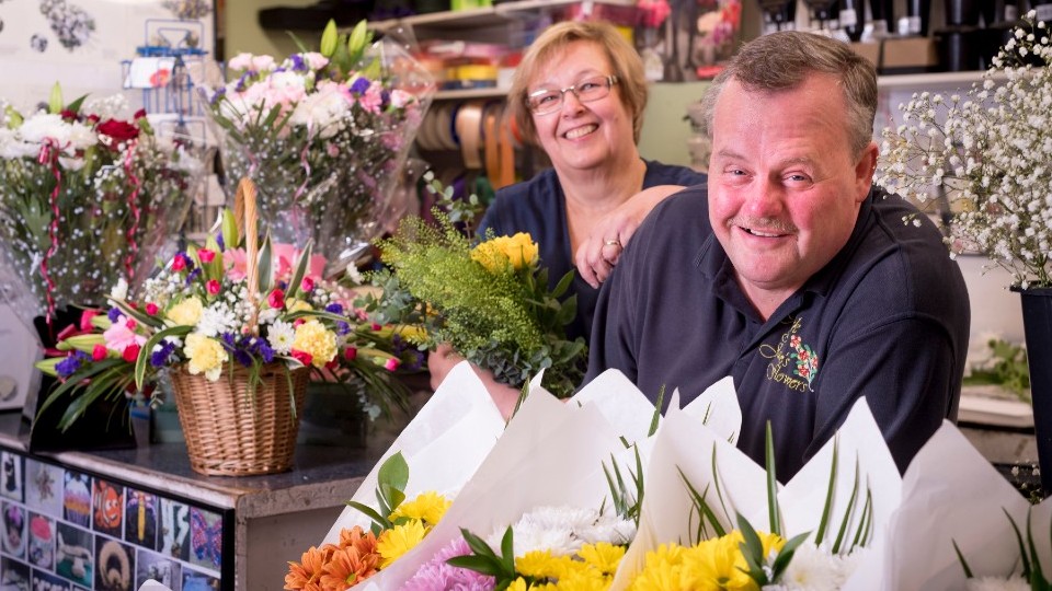 Rotherham markets . flower stall, 2 people